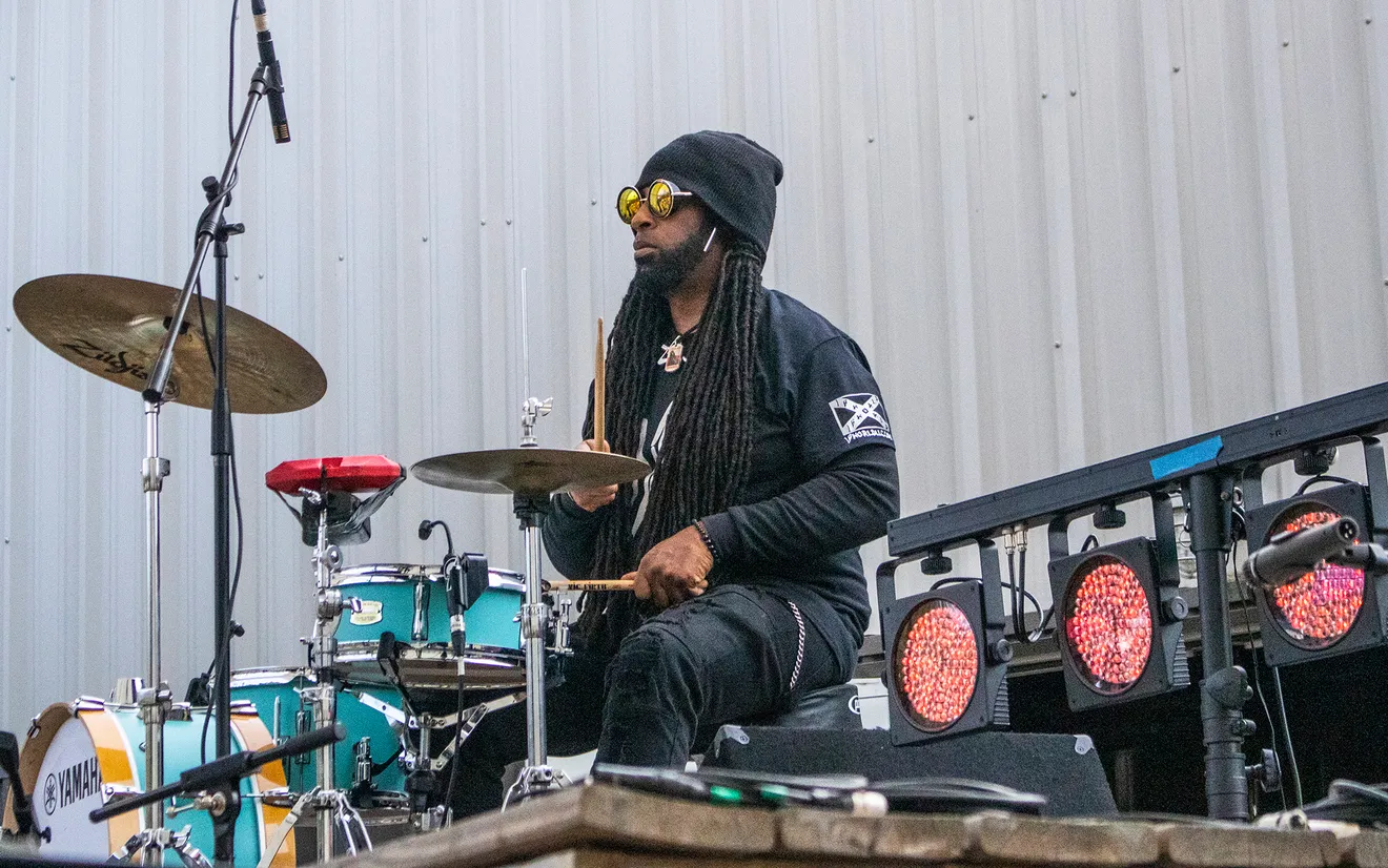 Drummer performing outdoors, from the United GA live-performance archive.