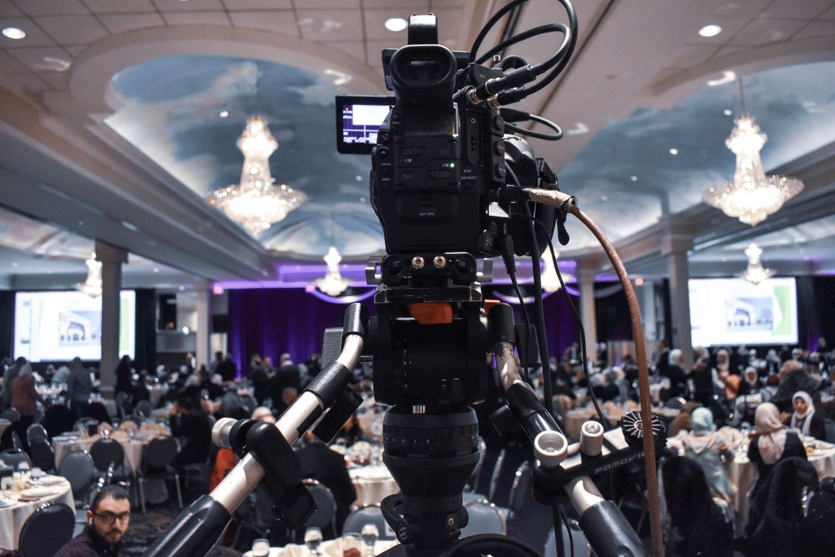 Professional camera recording a ballroom event — illustrative production photography.